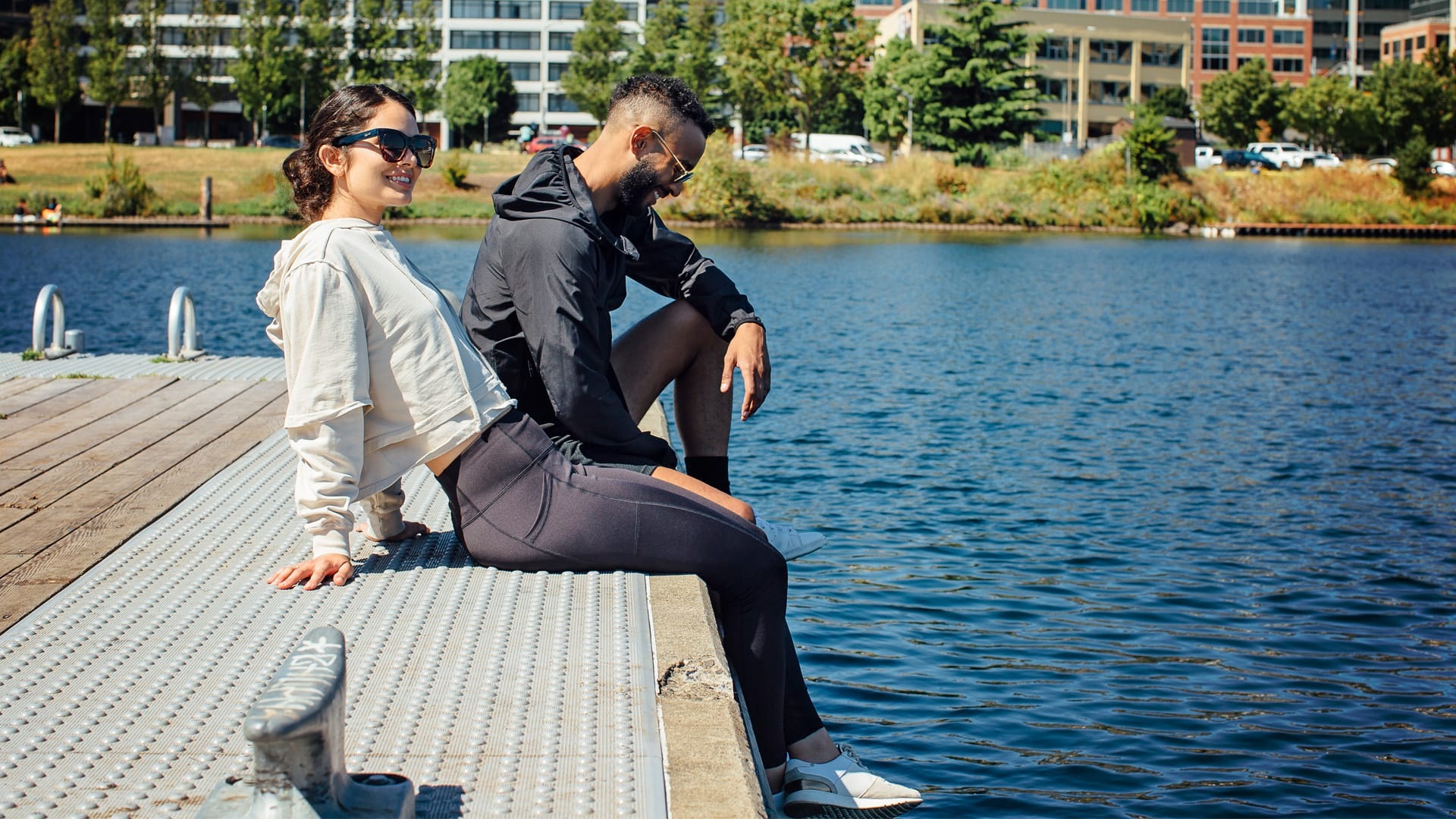 Couple relaxing by the water in Seattle, WA