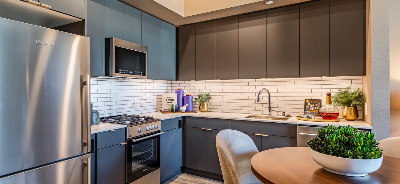 Well-lit kitchen with ample counter space. Well-lit kitchen with ample counter space